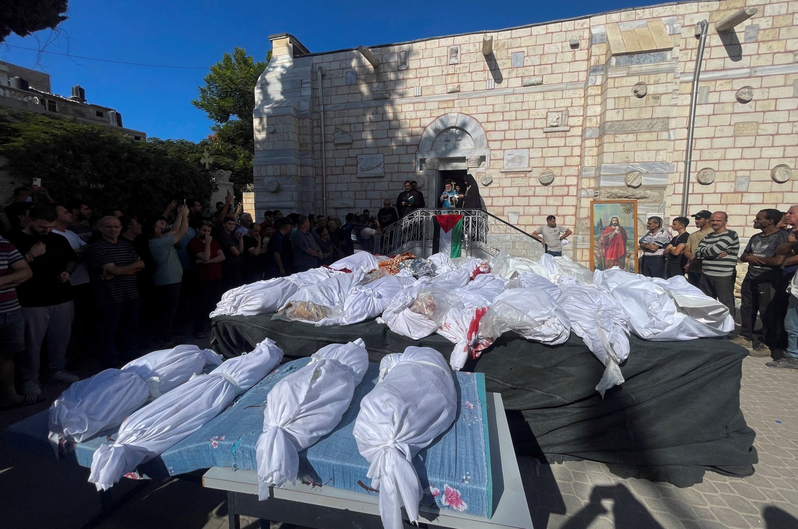 Mourners attend a funeral for Palestinians killed in an Israeli strike that damaged the Greek Orthodox Saint Porphyrius Church, where Palestinians who fled their homes were taking shelter, at the church in Gaza City, Oct. 20, 2023. (Reuters Photo)