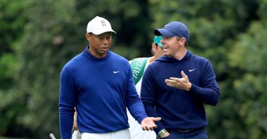 Rory McIlroy of Northern Ireland and Tiger Woods of the United States walk together on the 11th hole during a practice round prior to the 2023 Masters Tournament at Augusta National Golf Club in Augusta, Georgia, U.S., April 03, 2023. (Getty Images Photo)