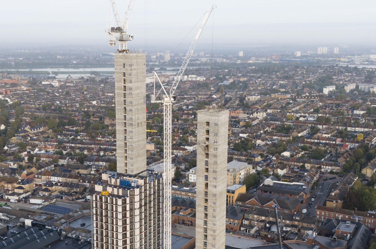 A picture taken with a drone shows a new residential building construction with rows of houses in east London, Britain, Oct. 23, 2023. (EPA Photo)