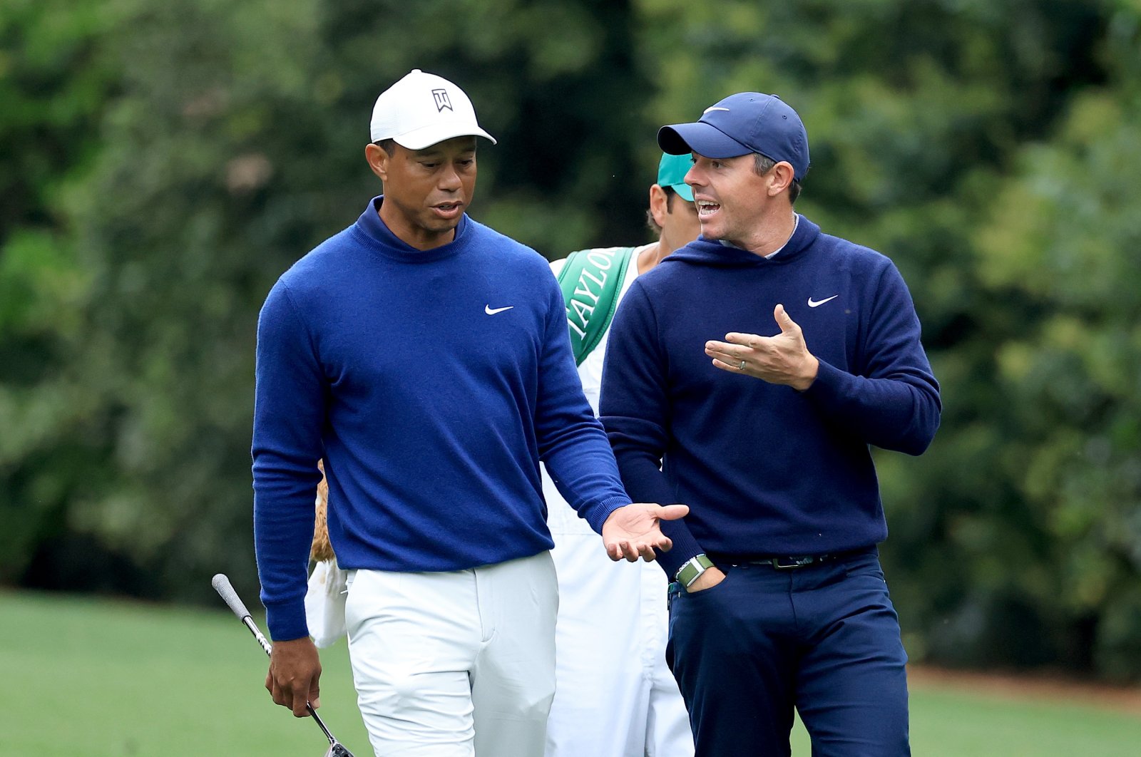 Rory McIlroy of Northern Ireland and Tiger Woods of the United States walk together on the 11th hole during a practice round prior to the 2023 Masters Tournament at Augusta National Golf Club in Augusta, Georgia, U.S., April 03, 2023. (Getty Images Photo)