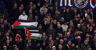 The Palestine flag is held during a minute silence during the Premier League match between Crystal Palace and Tottenham Hotspur at Selhurst Park, London, England, Oct. 27, 2023. (Getty Images Photo)