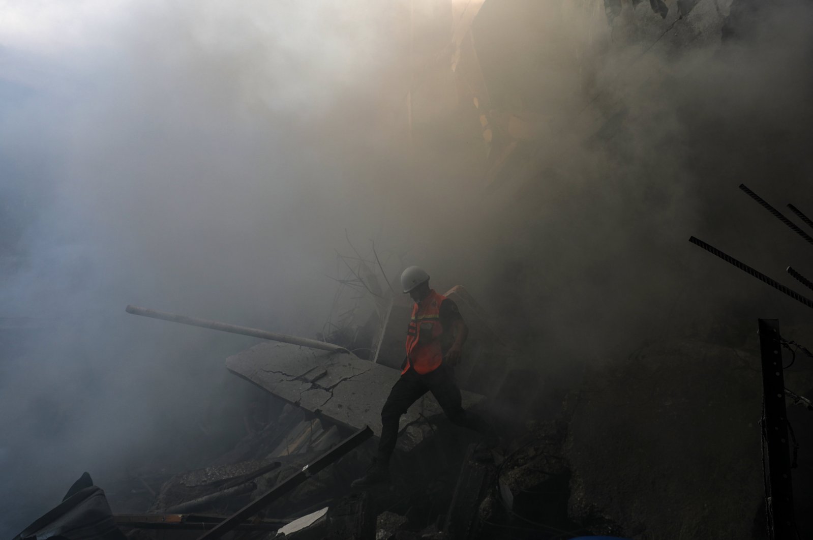 This file photo shows a Palestinian civil defense personnel work at the site of an Israeli rocket attack in Al-Shati refugee camp, west of Gaza City, Palestine, Oct. 14, 2023. (EPA Photo)