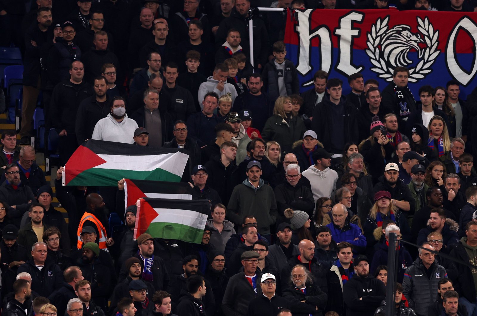 The Palestine flag is held during a minute silence during the Premier League match between Crystal Palace and Tottenham Hotspur at Selhurst Park, London, England, Oct. 27, 2023. (Getty Images Photo)