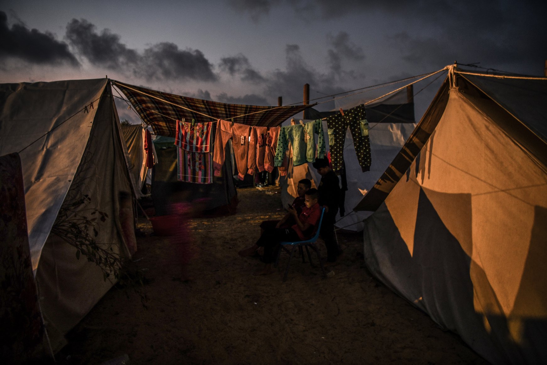 Fleeing horror, Gazan families sustain lives in UN tent | Daily Sabah