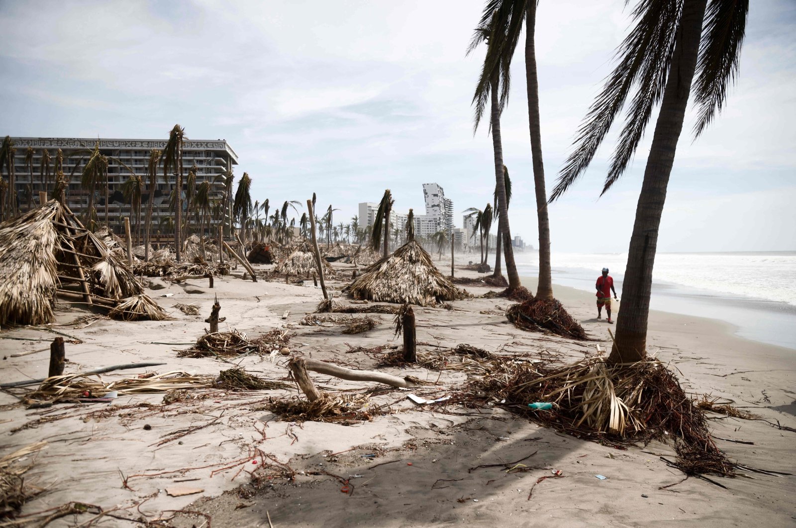 A person inspects the damage caused by the passage of Hurricane Otis, Acapulco, Guerrero State, Mexico, Oct. 28, 2023. (AFP Photo)