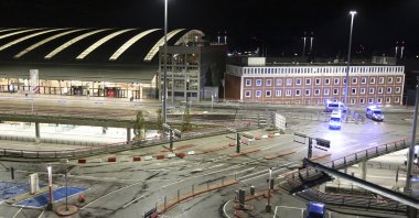 Police vehicles block access to Hamburg Airport during an operation, in Hamburg, Germany, Nov. 4, 2023. (AP Photo)