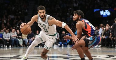 Boston Celtics forward Jayson Tatum (L) goes past Brooklyn Nets guard Cam Thomas during an NBA match, Brooklyn, New York, U.S., Nov 4, 2023. (Reuters Photo)  