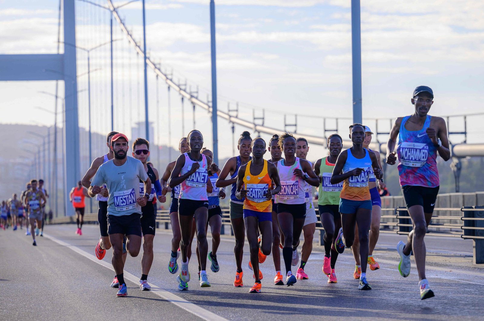 Runners cross the July 15 Martyrs Bridge during the 45th Istanbul Marathon, Istanbul, Türkiye, Nov. 5, 2023. (AFP Photo)
