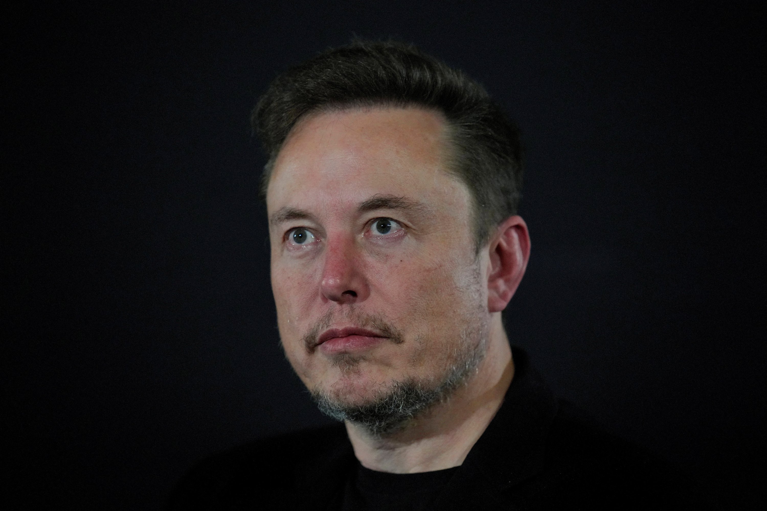 Premium Photo  A black man with blue eyes and a black background