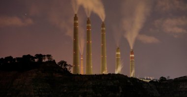 Smoke and steam billow from the coal-fired power plant owned by Indonesia Power, next to an area for the Java 9 and 10 Coal-Fired Steam Power Plant project in Suralaya, Banten province, Indonesia, July 11, 2020. (Reuters Photo)
