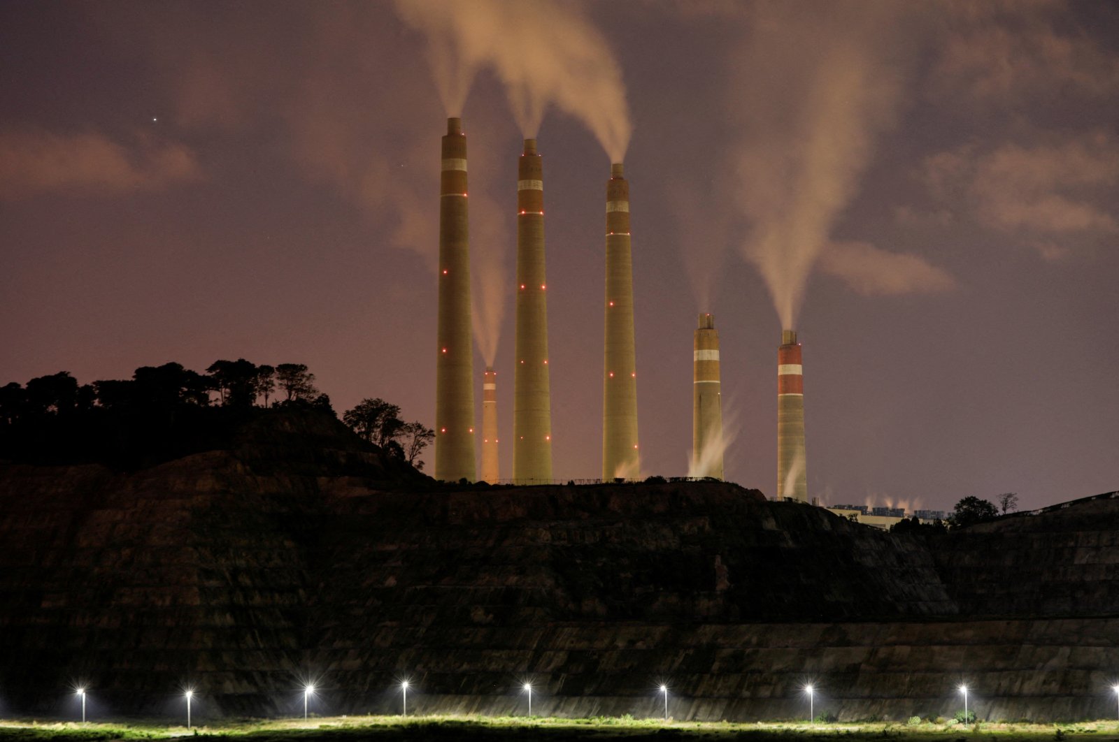 Smoke and steam billow from the coal-fired power plant owned by Indonesia Power, next to an area for the Java 9 and 10 Coal-Fired Steam Power Plant project in Suralaya, Banten province, Indonesia, July 11, 2020. (Reuters Photo)