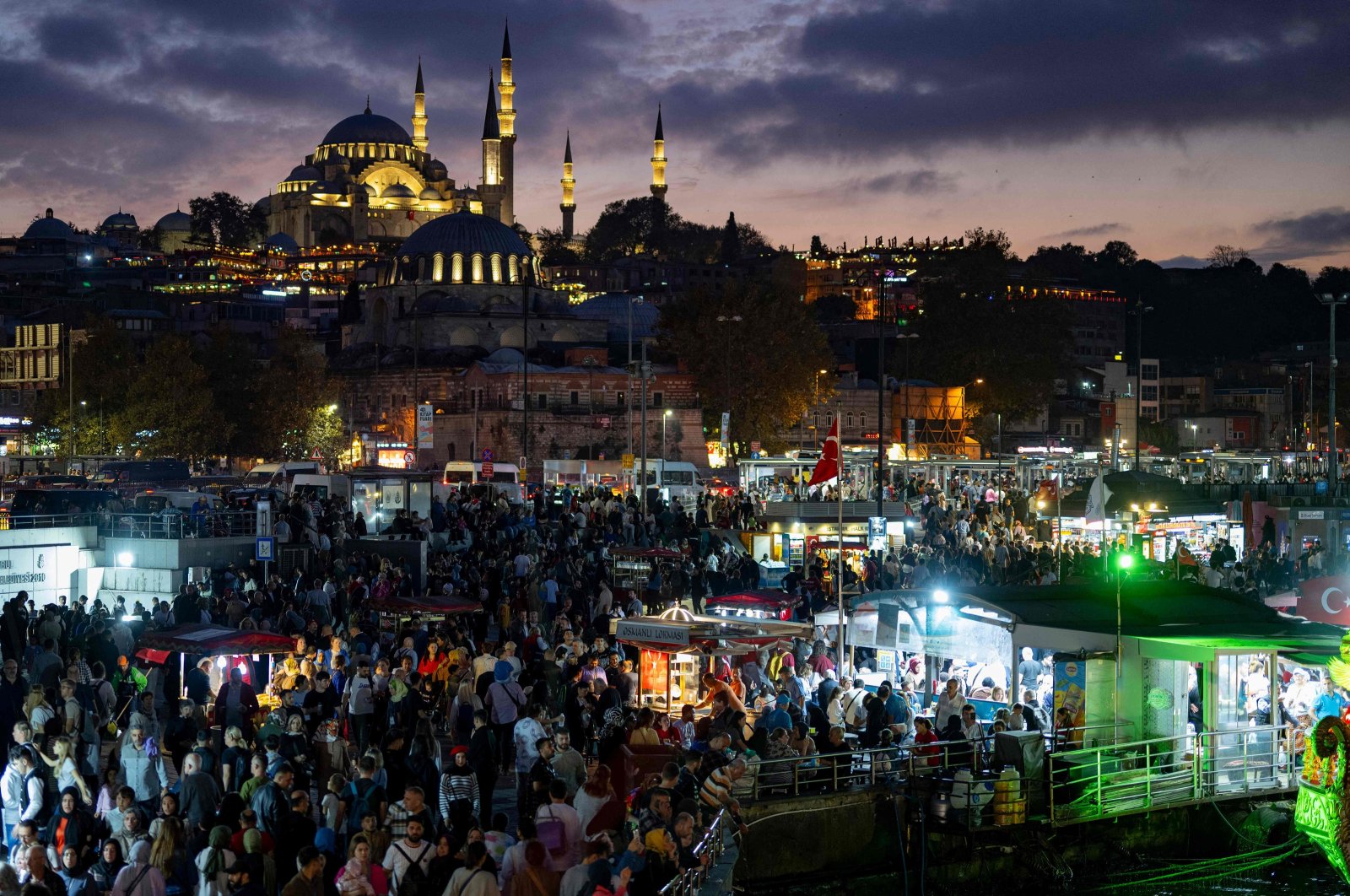 People walk around Eminönü Square in Istanbul during celebrations to mark the 100th anniversary of the Republic of Türkiye, Oct. 29, 2023. (AFP Photo)