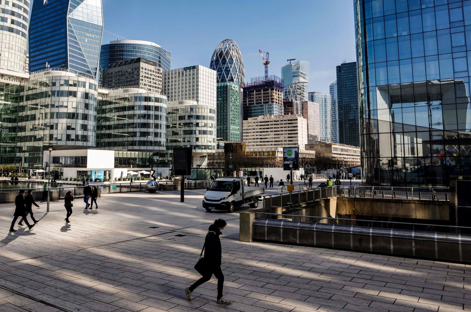 People walk in Paris&#039; business district of la Defense, outside Paris, France, March 23, 2021. (AFP Photo)