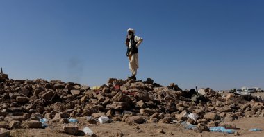 An Afghan man stands on the debris of damaged houses after the recent earthquake, in the district of Zinda Jan, Herat, Afghanistan, Oct. 9, 2023. (Reuters Photo)