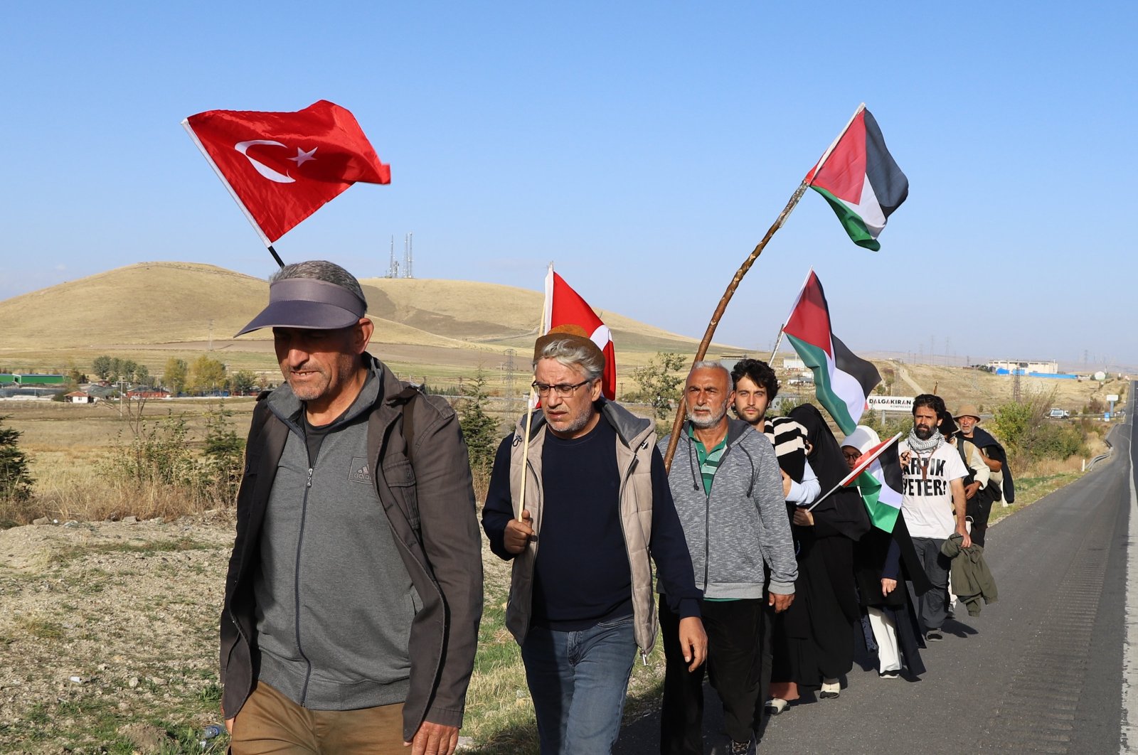 Turkish activists march from Istanbul to Palestine to call attention to Israeli attacks on the Gaza Strip along a highway in the capital Ankara, Türkiye, Nov. 5, 2023. (AA Photo)