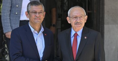 Main opposition's Republican People's Party's (CHP) newly-elected Chair Özgür Özel (L) shakes hands with Kemal Kılıçdaroğlu as he visits him in his home ahead of a handover ceremony in Ankara, Türkiye, Nov. 8, 2023. (AA Photo)