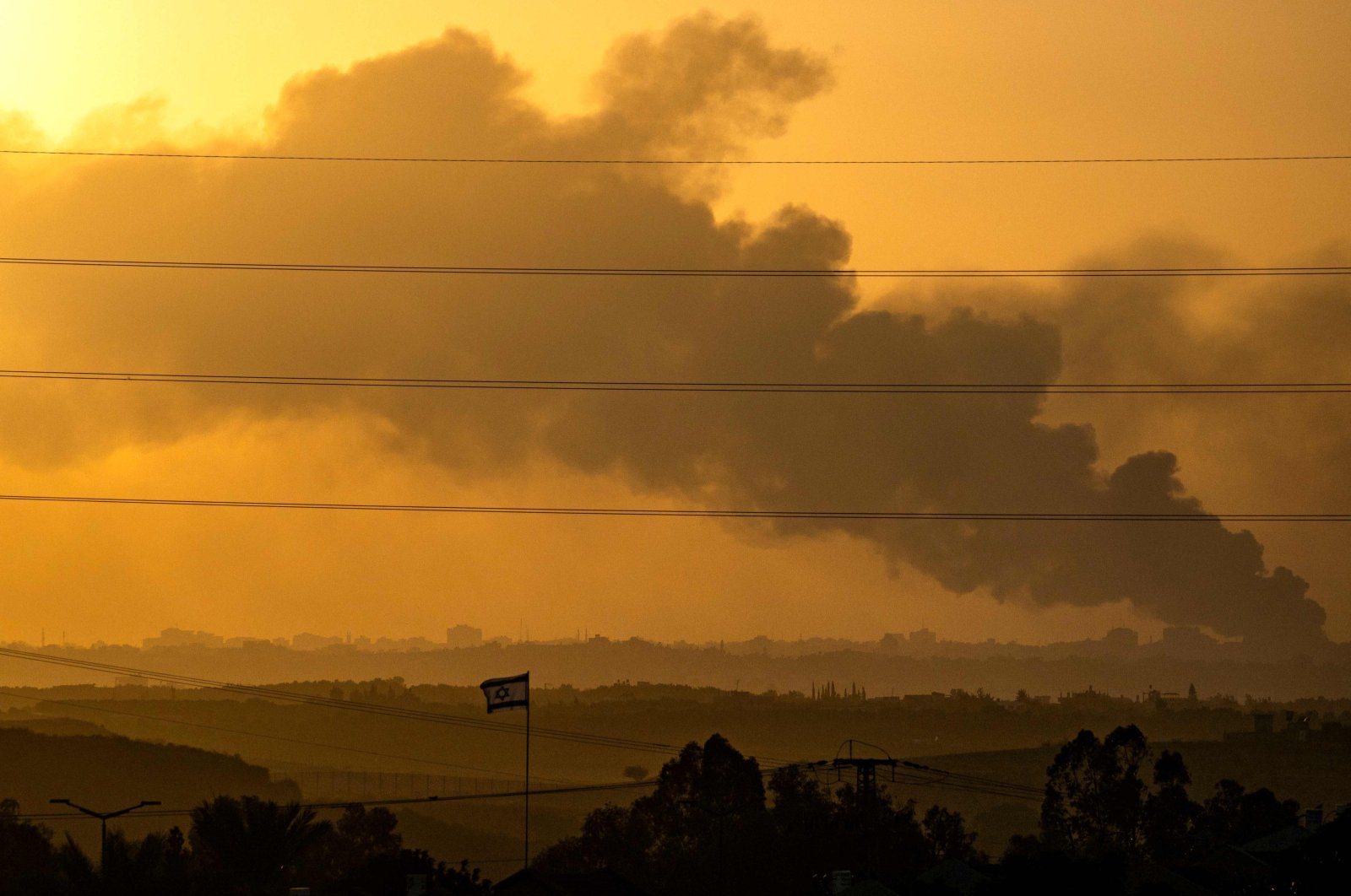 This picture taken from southern Israel, near the border with the Gaza Strip, shows smoke rising from northern Gaza during shelling by Israeli forces, Nov. 7, 2023. (AFP Photo)