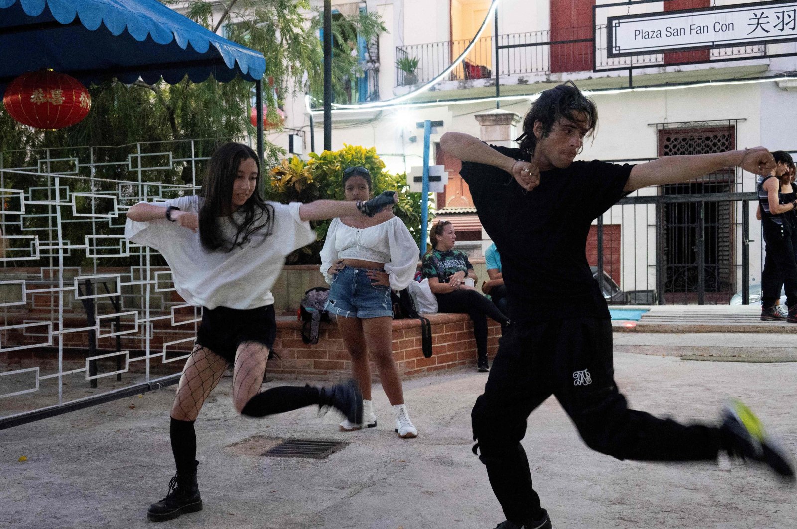 Young Cuban fans of popular Korean K-pop music dance at the San Fan Con square in Havana, Cuba, Oct. 21, 2023. (AFP Photo)