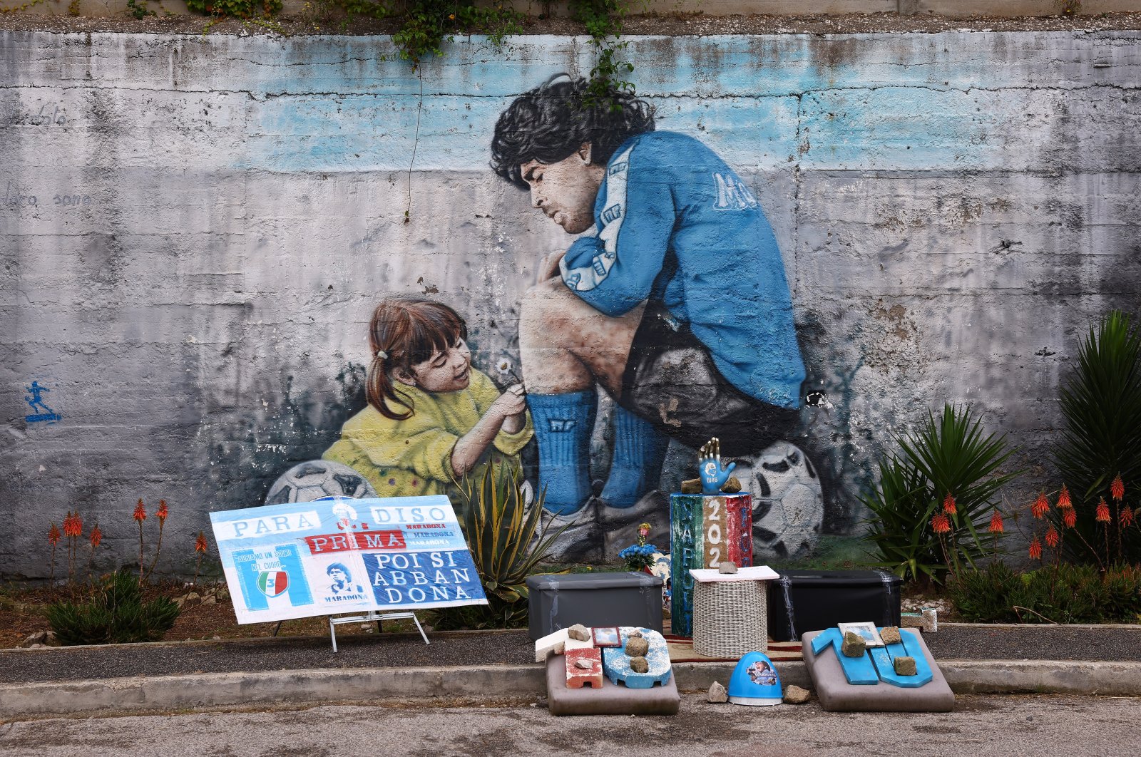 A mural of Diego Maradona is seen outside the Campo Sportivo Paradiso, Naples, Italy, June 4, 2023. (Getty Images Photo)