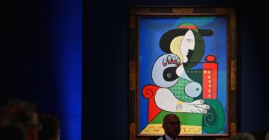 Sotheby&#039;s employees take phone bids during the &quot;The Emily Fisher Landau Collection: An Era Defined&quot; auction for Pablo Picasso&#039;s  &quot;Femme a la Montre&quot; at Sotheby&#039;s in New York City, New York, U.S., Nov. 8, 2023. (AFP Photo)