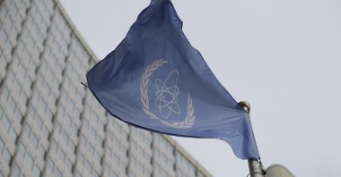 The flag of the International Atomic Energy Agency flies in front of its headquarters in Vienna, Austria, Feb. 6, 2023. (AP Photo)