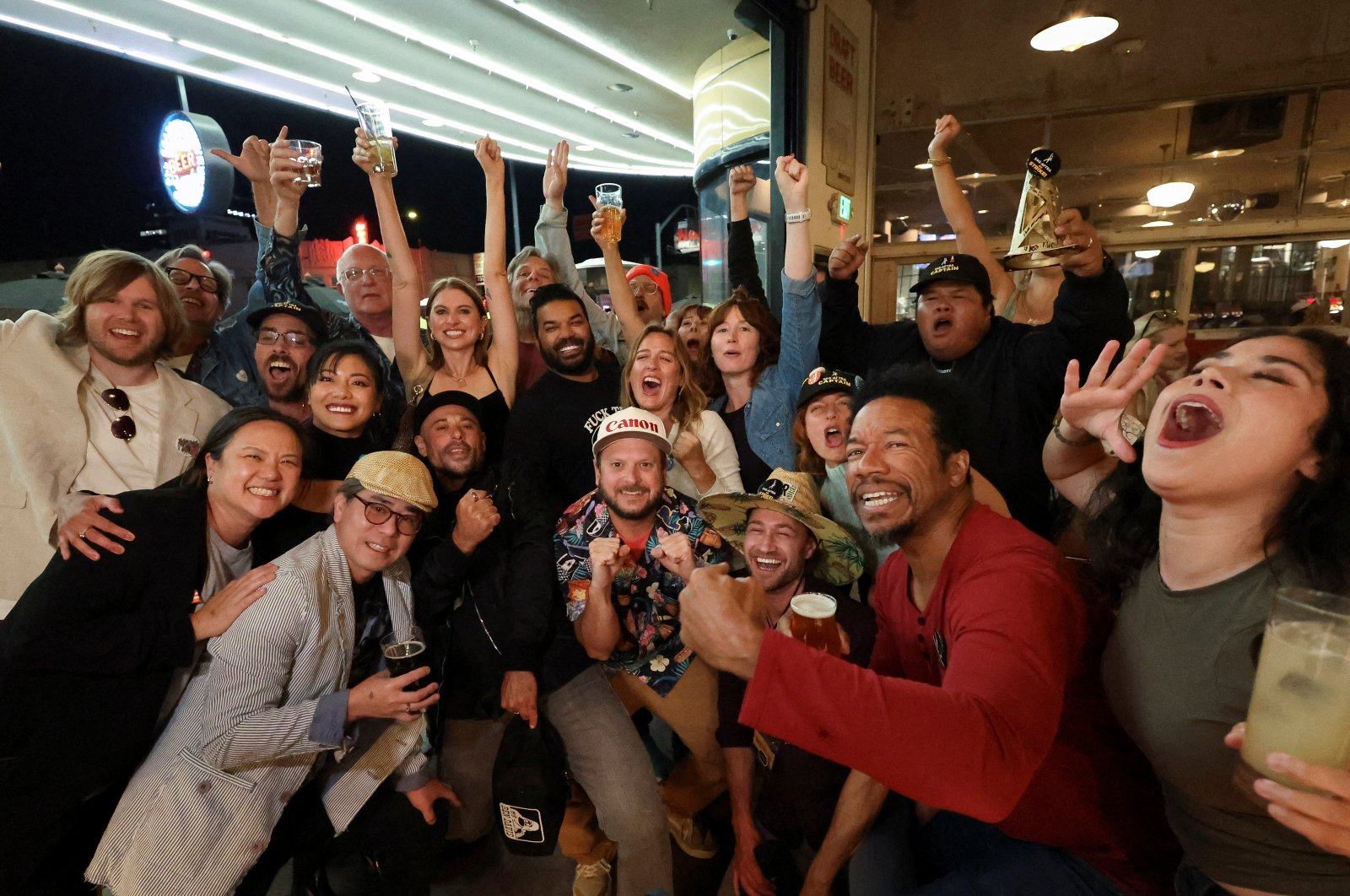 People celebrate at a brewery after the SAG-AFTRA TV/Theatrical Committee approved a tentative agreement with the Alliance of Motion Picture and Television Producers (AMPTP) to bring an end to the 118-day actors strike, Los Angeles, California, U.S., Nov. 8, 2023. (Reuters Photo)