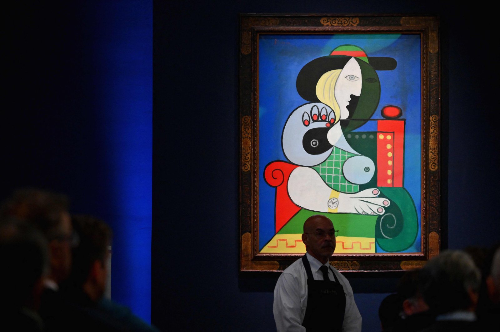 Sotheby&#039;s employees take phone bids during the &quot;The Emily Fisher Landau Collection: An Era Defined&quot; auction for Pablo Picasso&#039;s  &quot;Femme a la Montre&quot; at Sotheby&#039;s in New York City, New York, U.S., Nov. 8, 2023. (AFP Photo)
