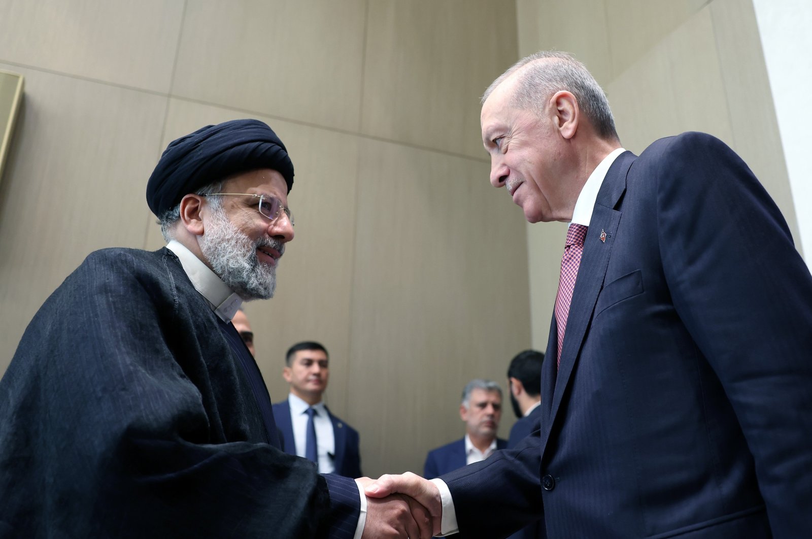 President Recep Tayyip Erdoğan shakes hands with President Raisi, in Tashkent, Uzbekistan, November 9, 2023. (İHA Photo) 