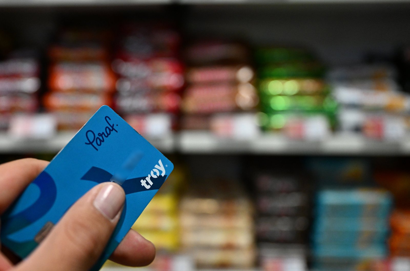 The bank card with the TROY logo is seen in a market at an undisclosed location, Türkiye, Nov. 9, 2023. (AA Photo)