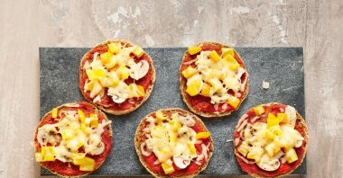 As quick to prepare as a frozen pizza: halved soft bread rolls that can be toasted are also great as the base of mini pizzas. (dpa Photo)