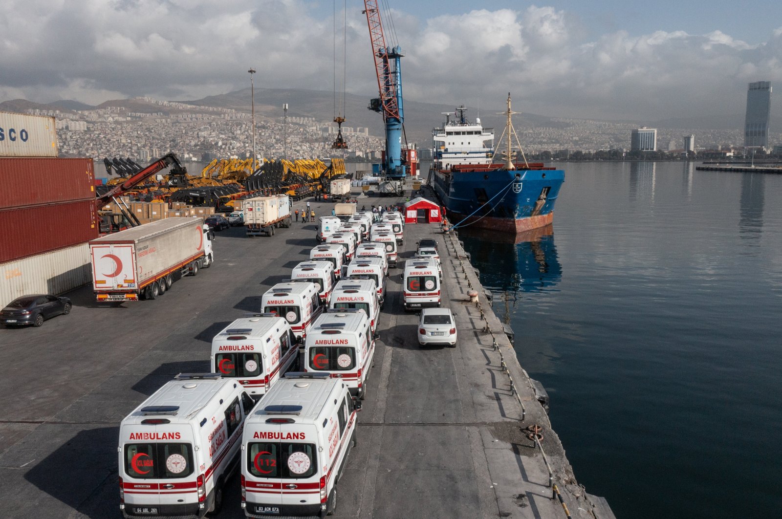 Ambulances are seen lined up on the docks as workers load a ship full of medical aid for Palestinians in the Gaza Strip, at Alsancak Port in western Izmir province, Türkiye, Nov. 9, 2023. (AA Photo)