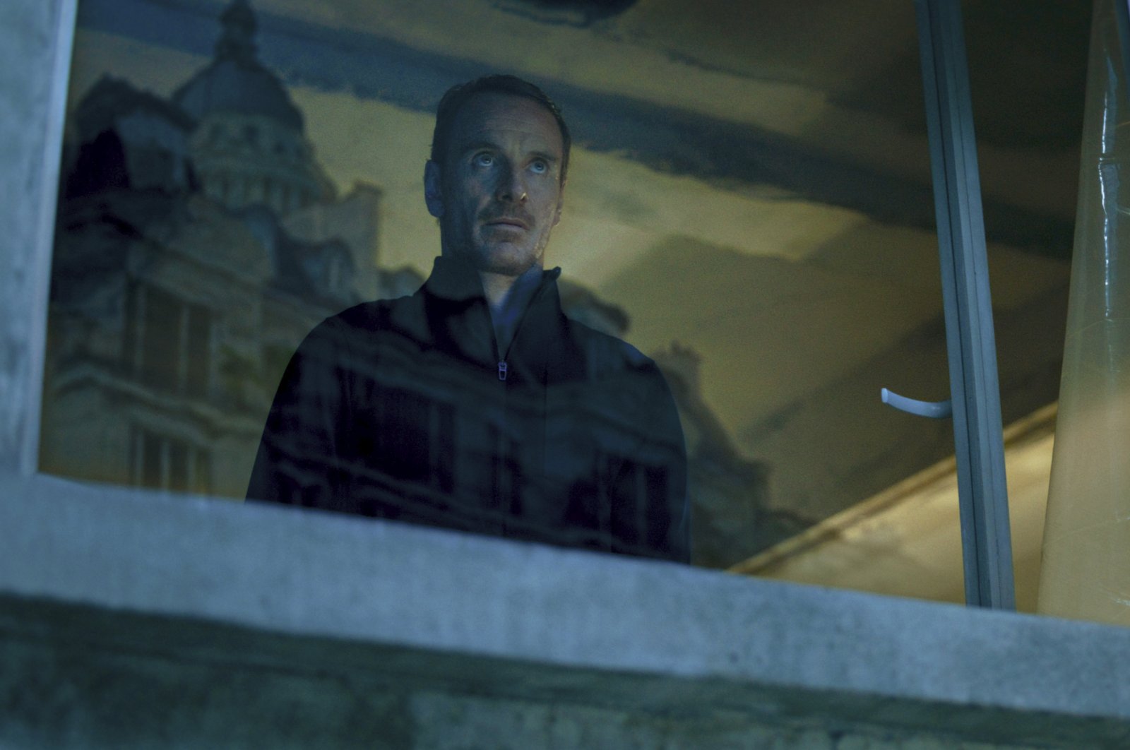 This image released by Netflix shows Michael Fassbender as an assassin in a scene from &quot;The Killer.&quot; (AP Photo)