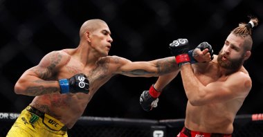 Alex Pereira of Brazil punches Jiri Prochazka of the Czech Republic in the UFC light heavyweight championship fight, New York, U.S., Nov. 11, 2023. (AFP Photo)