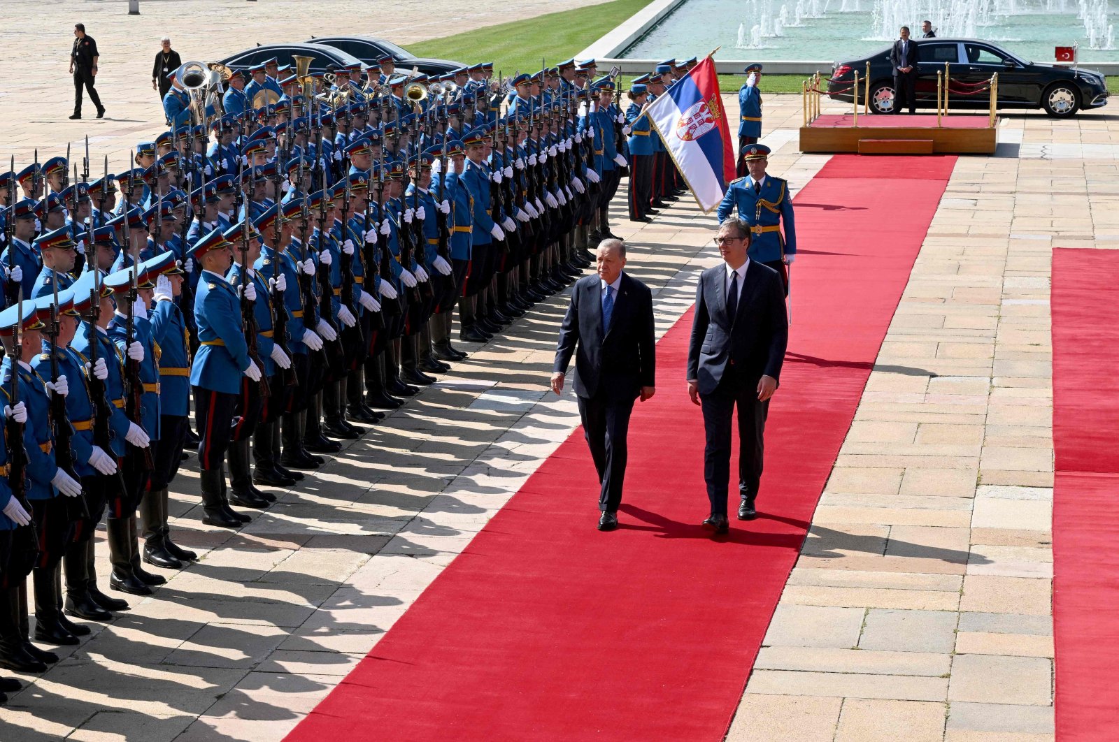 Serbian President Aleksandar Vucic (R) walks past a guard of honor with President Recep Tayyip Erdoğan before their meeting in Belgrade, Serbia, Sept. 7, 2022. (AFP Photo)