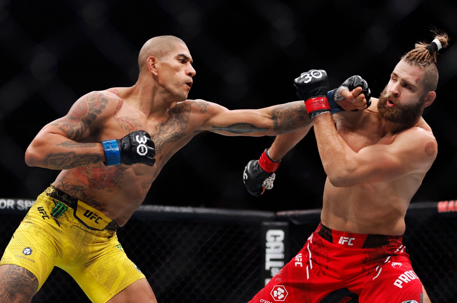 Alex Pereira of Brazil punches Jiri Prochazka of the Czech Republic in the UFC light heavyweight championship fight, New York, U.S., Nov. 11, 2023. (AFP Photo)