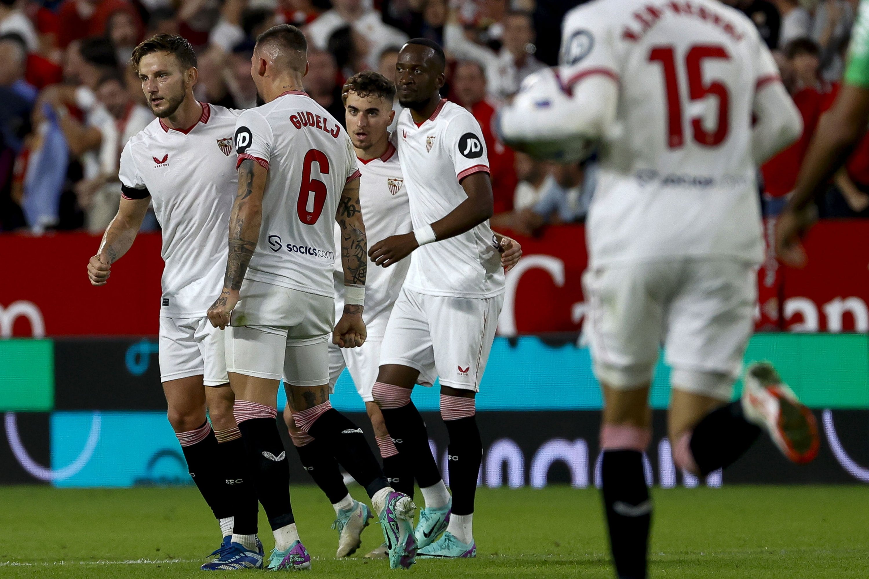 Sevilla's midfielder Ivan Rakitic (L) celebrates with teammates after scoring the 1-1 goal during the Spanish LaLiga soccer match between Sevilla FC and Real Betis, Seville, Spain, Nov. 12, 2023. (EPA Photo)