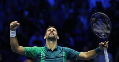 Serbia&#039;s Novak Djokovic celebrates victory against Denmark&#039;s Holger Rune in their round robin match and becomes the year end World No. 1, during day one of the Nitto ATP Finals at Pala Alpitour, Turin, Italy, Nov. 12, 2023. (Getty Images Photo)