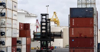 A worker moves containers at the compound of ports operator DP World at Port Botany, Sydney, Australia, Nov. 13, 2023. (AFP Photo)