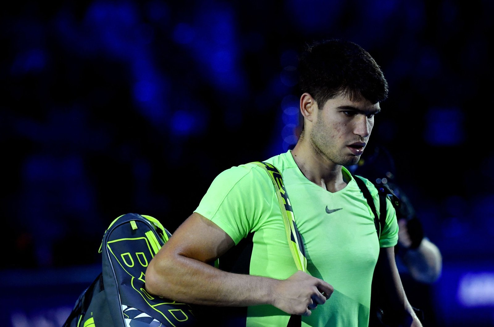 Spain&#039;s Carlos Alcaraz leaves the court after losing his first round-robin match against Germany&#039;s Alexander Zverev at the ATP Finals tennis tournament in Turin, Italy, Nov. 13, 2023. (AFP Photo)