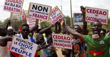 Supporters of Capt. Ibrahim Traore protests against France and the West African regional bloc known as ECOWAS in the streets of Ouagadougou, Burkina Faso, Oct. 4, 2022. (AP Photo)