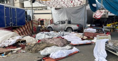 Bodies of Palestinians killed in Israeli strikes lie on the ground in the yard of Al-Shifa Hospital as health officials say they are unable to bury them due to the Israeli ground operation around the hospital, in Gaza City, Palestine, Nov. 12, 2023. (Reuters Photo)