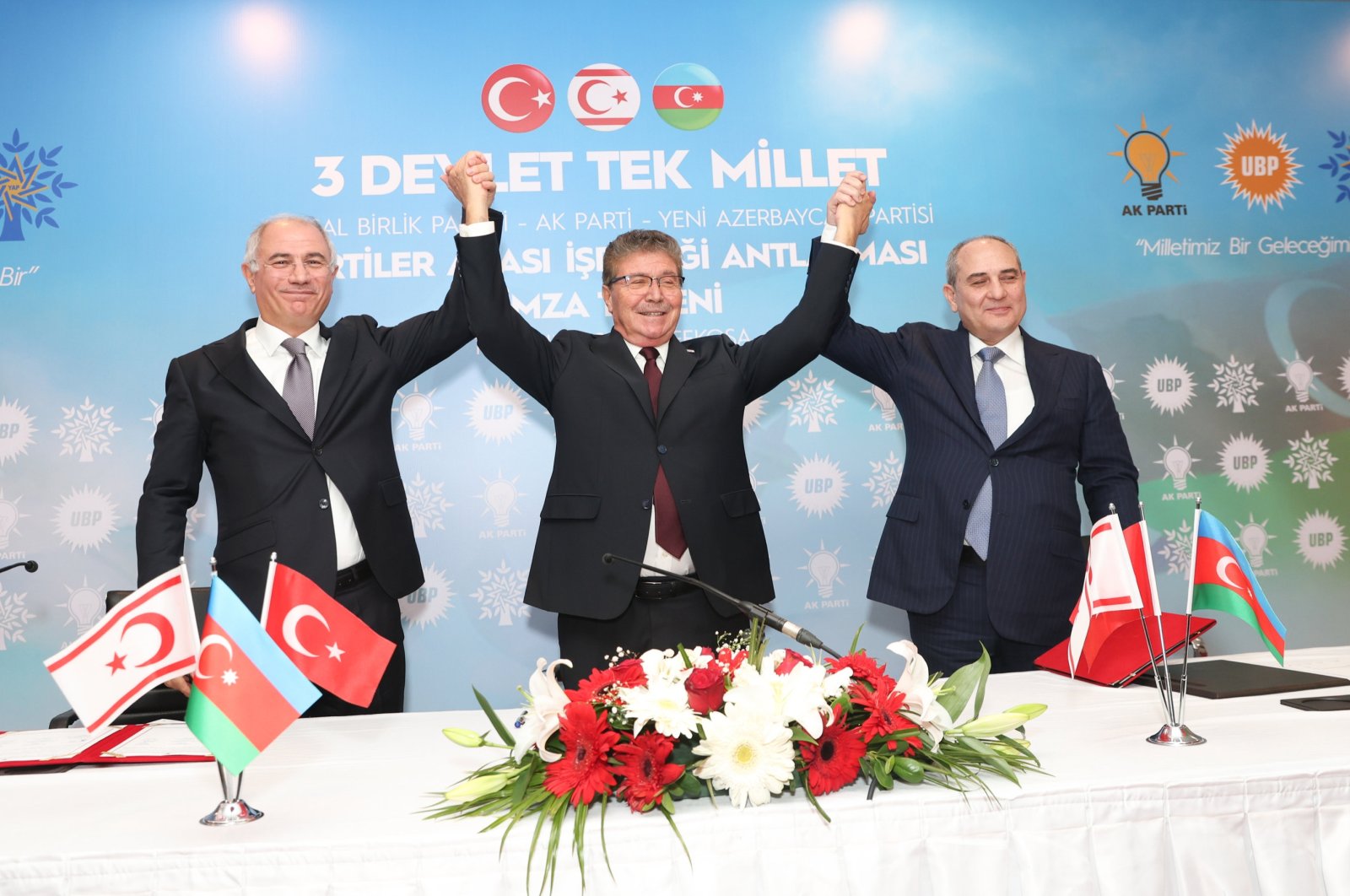 Türkiye&#039;s Justice and Development Party&#039;s (AK Party) Deputy Chairman Efkan Ala (L), New Azerbaijan Party&#039;s Deputy Chairperson Tahir Budagov (R) and TRNC&#039;s National Unity Party (UBP) Chairperson and Prime Minister Üstel (C) pose after signing a political cooperation agreement, Lefkoşa (Nicosia), Turkish Cyprus, Nov. 14, 2023. (AA Photo)