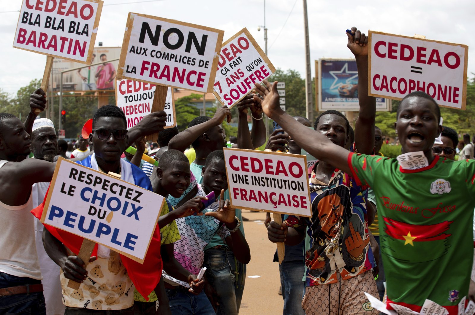 Supporters of Capt. Ibrahim Traore protests against France and the West African regional bloc known as ECOWAS in the streets of Ouagadougou, Burkina Faso, Oct. 4, 2022. (AP Photo)