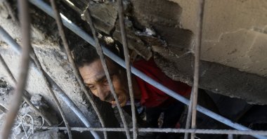 Palestinians inspect the rubble of destroyed buildings following Israeli airstrikes on the town of Khan Younis, Gaza Strip, Palestine, Nov. 6, 2023. (AP Photo)