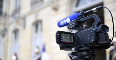 Illustration with a TV camera lens with the logo of Agence France-Presse (AFP) at the Hotel Matignon, Paris, France, June 28, 2023. (Reuters File Photo)