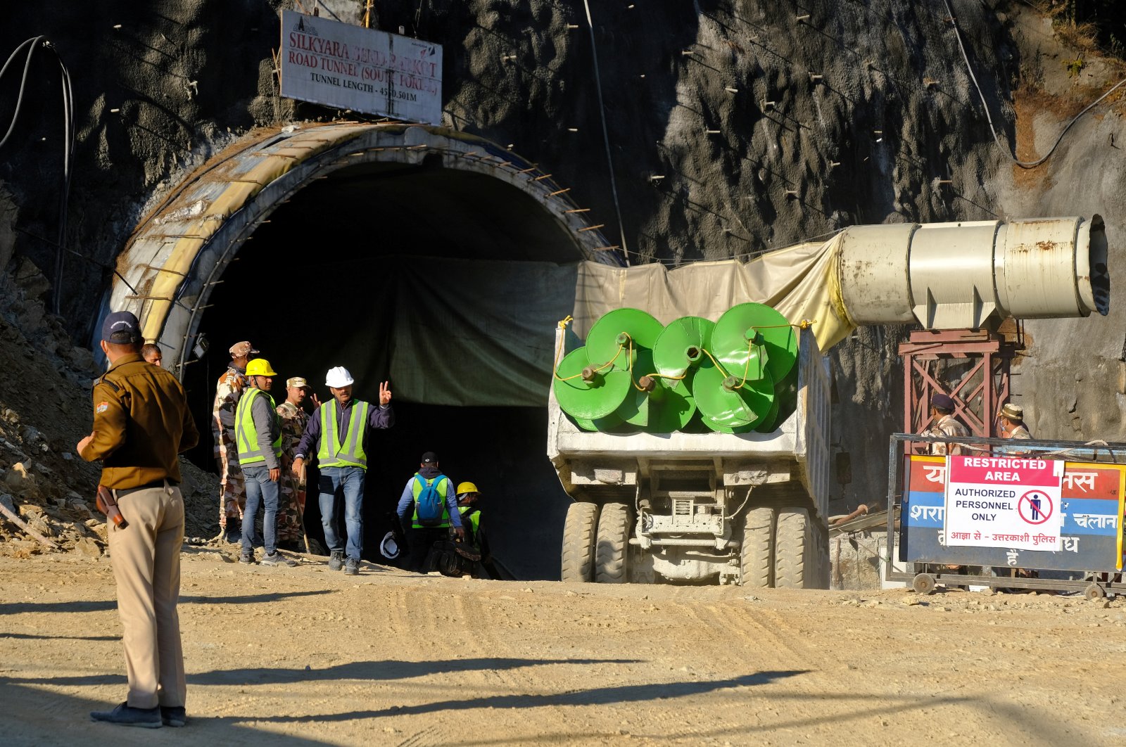 A supply truck loaded with augers prepares to enter a tunnel where 40 road workers are trapped after a portion of the tunnel collapsed in Uttarkashi in the northern state of Uttarakhand, India, Nov. 15, 2023. (Reuters Photo)