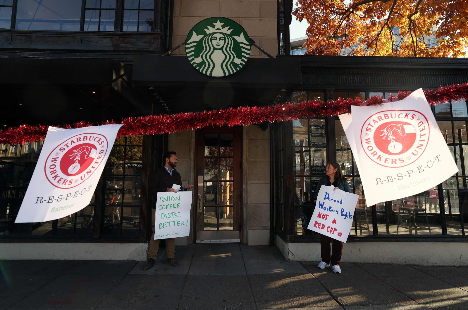 Members and supporters of Starbucks Workers United protest outside of a Starbucks store in Dupont Circle, Washington, D.C., U.S., Nov. 16, 2023. (AFP Photo)