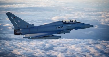 A Eurofighter jet accompanies the flight of German Chancellor Olaf Scholz in an Airbus A400M Airforce transport aircraft, on his way to visit the Cologne-Bonn Air Force base, Germany, Oct. 23, 2023. (Reuters Photo)