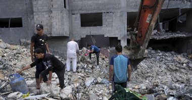 Palestinians recover the bodies of the al Meghari family killed in the Israeli bombardment of the Gaza Strip, Bureij refugee camp, Gaza Strip, Nov. 14, 2023. (AP Photo)