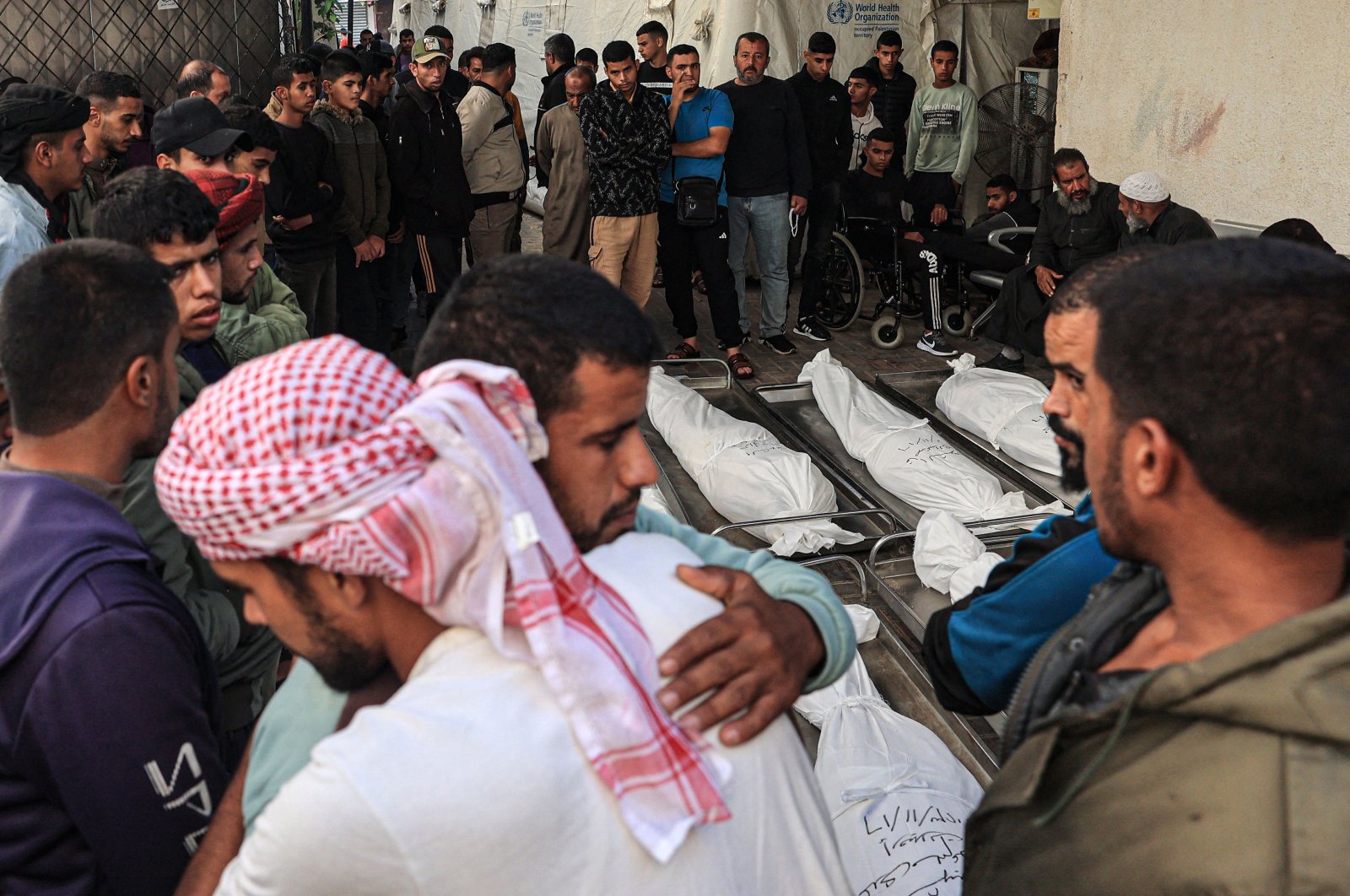 Palestinians mourn over bodies following overnight Israeli bombardment in Rafah in the southern Gaza Strip, Palestine, on Nov.17, 2023. (AFP Photo)